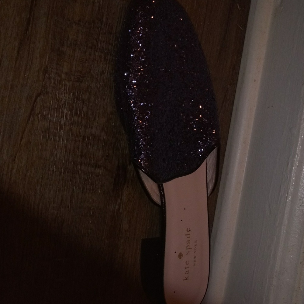 A glittery black flat